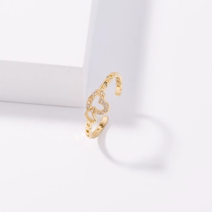 Detailed view of adjustable gold ring with double heart charms and chain link band