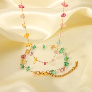Detail of colorful natural stone beads on a gold-plated stainless steel chain necklace