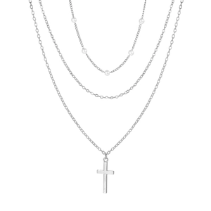 Three-layer silver necklace set with white pearls and a minimalist cross pendant on white back