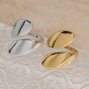 Adjustable bypass ring set in gold and silver finish with teardrop design