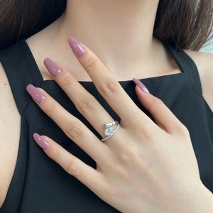 Detail of S925 sterling silver ring with large oval centerpiece on model finger