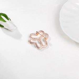 Back view of rose gold round crystal flower brooch with pin buckle on white background