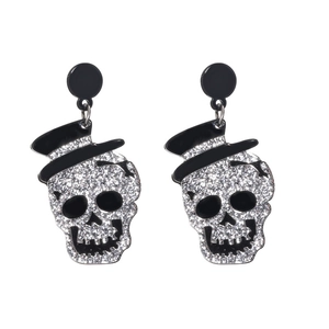 Sparkling Halloween skull stud earrings with black top hat and silver rhinestones on white background