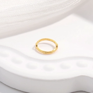 Macro shot showing the S925 hallmark on gold plated lace pattern jewelry component