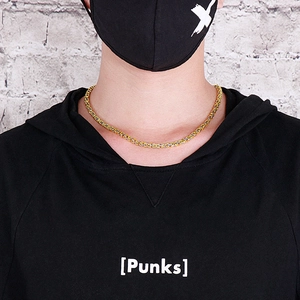 Close-up of 4mm stainless steel woven king chain necklace worn in a streetwear style