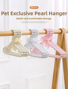 Detailed view of pearl pet hangers with silk bows in white, grey, and pink styles