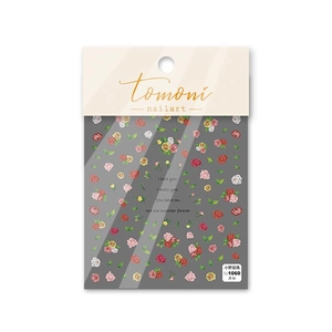 Flat lay of Tomoni 1060 rose nail art stickers with colorful flowers and green leaves