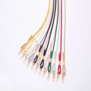 Various colored PU leather crossbody straps with gold metal hardware and buckles