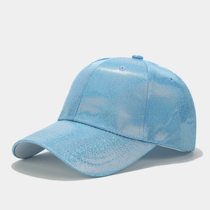 Macro detail of sky blue baseball cap with sparkling glitter finish and reinforced brim