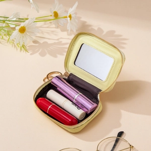 Portable yellow quilted cosmetic bag with mirror and lipstick holder for women