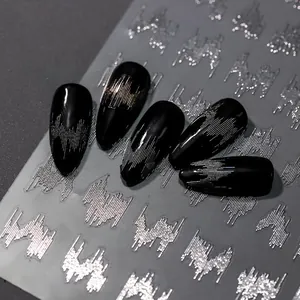 Macro detail of silver laser nail stickers with wavy metal lines on black nails