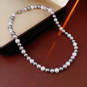 Elegant multi-colored pearl necklace with silver, grey and purple beads on leather
