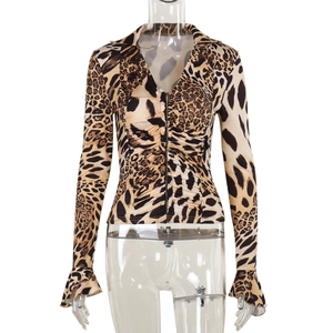 Detail of deep V-neck leopard print top showing zipper closure and flared sleeve texture