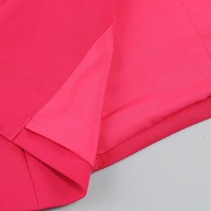 Detail of pink blazer lining and high-quality stitching on the tailored sleeve cuff