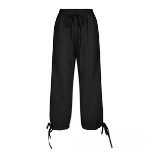 Detail of adjustable drawstring hem on black linen loose wide-leg casual pants