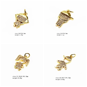 Detailed view of four gold-plated boy and girl pendants with micro-pave cubic zirconia