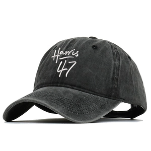 Washed black vintage baseball cap with Harris 47 white embroidery on a plain background