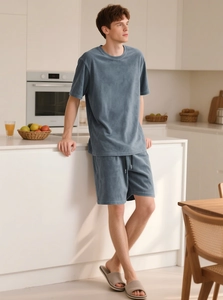 Close-up of fog blue men's loungewear set featuring soft textured short sleeve tee and shorts