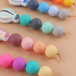 Four colorful silicone pacifier clips with hot air balloon wooden beads for babies