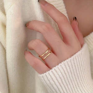 Minimalist double layer 18K gold plated silver ring shown on finger with knit sweater