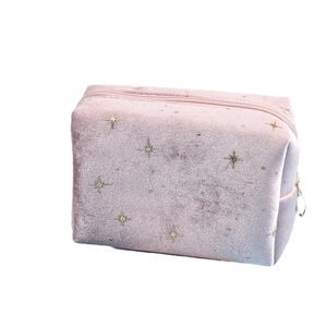 Pink velvet cosmetic bag with gold star pattern and zipper for travel organization