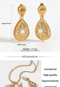 Macro detail of gold teardrop jewelry set featuring shell textures and starburst stones
