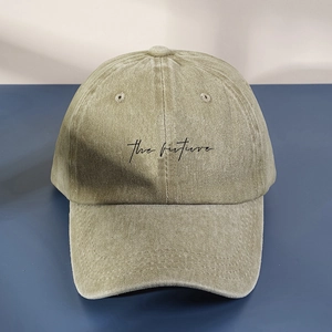 Washed cotton baseball cap in olive green featuring the future printed text