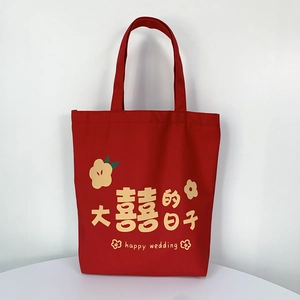 Detail of red wedding canvas tote bag with yellow Happy Wedding floral embroidery