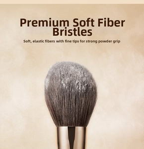 Close-up of soft fiber bristles and gold ferrule on a professional makeup brush
