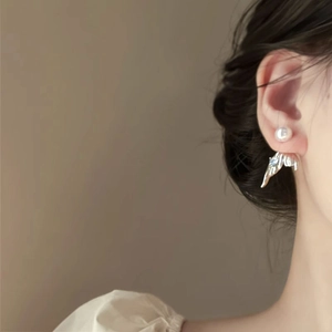 French style pearl fishtail earrings with irregular silver metal drops on model
