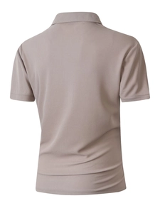 Close-up of men's polo shirt featuring breathable micro-mesh fabric texture in taupe