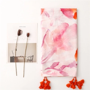 Abstract watercolor floral beach shawl with bright orange tassels and herringbone texture