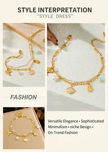 Detail of double-layer gold anklet with pearl, elephant and leaf charms on stone