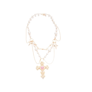 Cross pearl necklace with pink heart and gold star charms in a vintage Y2K layered style
