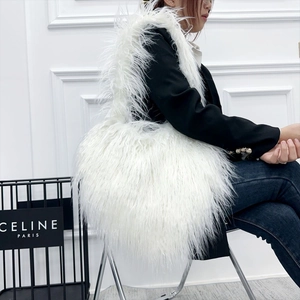 Chic white faux fur heart-shaped fluffy tote bag styled with a modern outfit
