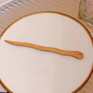 Minimalist wavy wooden hair stick with natural grain and decorative hole for accessories