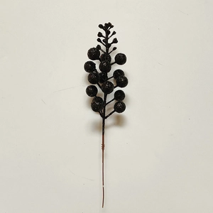 Detail of decorative black berries branch with glitter coating for DIY floral arrangements