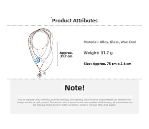 Detailed view of layered bohemian necklace with evil eye charm and celestial pendants