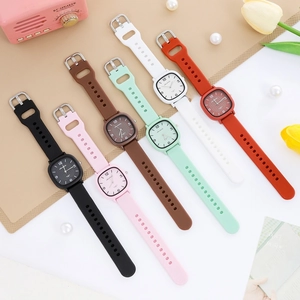 Flat lay of square quartz watches in six colorful macaron shades with silicone straps