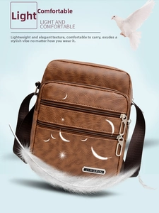 Detailed close-up of brown PU leather bag with multi-zipper compartments and adjustable strap