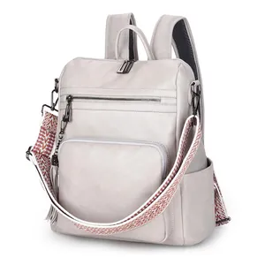 Chic beige faux leather backpack for women with ethnic geometric patterned strap