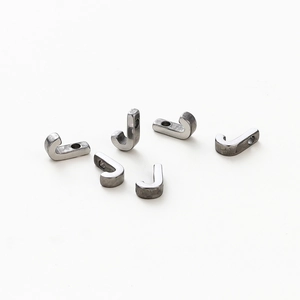 Detail of six silver J-shaped metal hook charms with 1.8mm holes for DIY jewelry making