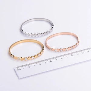 Minimalist stainless steel heart bangle in gold silver and rose gold finishes