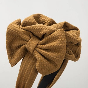 Elegant caramel brown textured knit floral bow headband for a sweet lady style