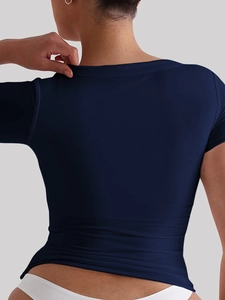 Back view of a slim-fit dark blue crew neck T-shirt showcasing fabric texture and fit