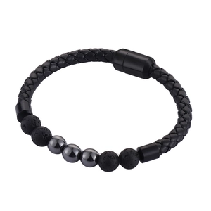 Detail of men's leather bracelet with volcanic stone beads and magnetic clasp close-up