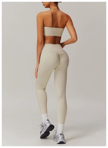 Detail view of beige high waist yoga leggings with scrunch butt lifting design for women