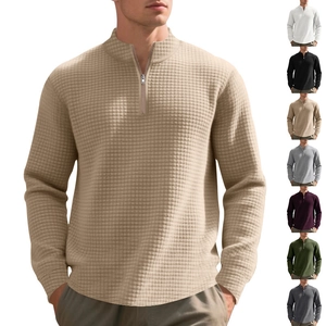 Detail of khaki waffle knit quarter-zip polo with a display of seven available colors