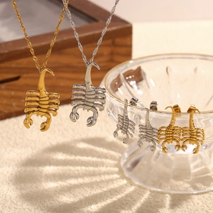 Scorpion pendant necklaces and stud earrings set in gold and silver stainless steel