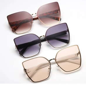 Three pairs of oversized cat eye sunglasses with gradient lenses and leopard print temples
